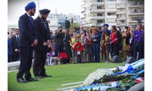 Representatives of the Sikh Community lay a wreath